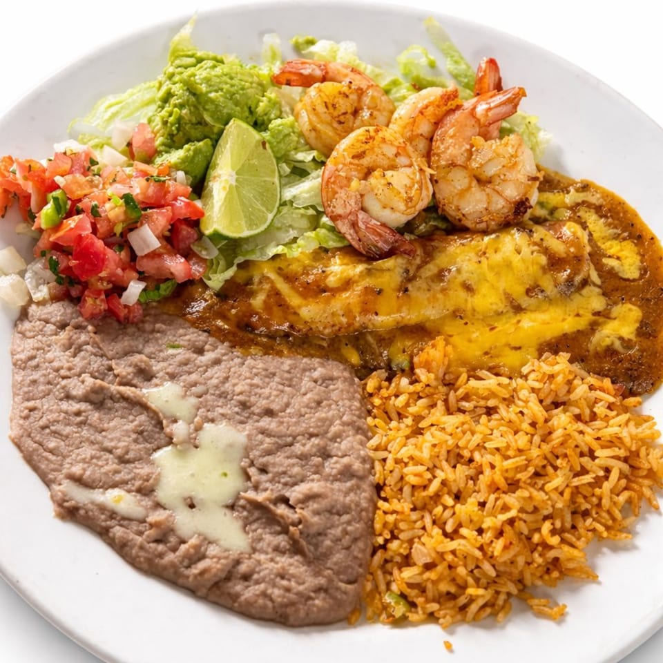 Los Agaves Mexican Restaurant's shrimp enchilada plate with rice, refried beans, guacamole, pico de gallo, and lime.