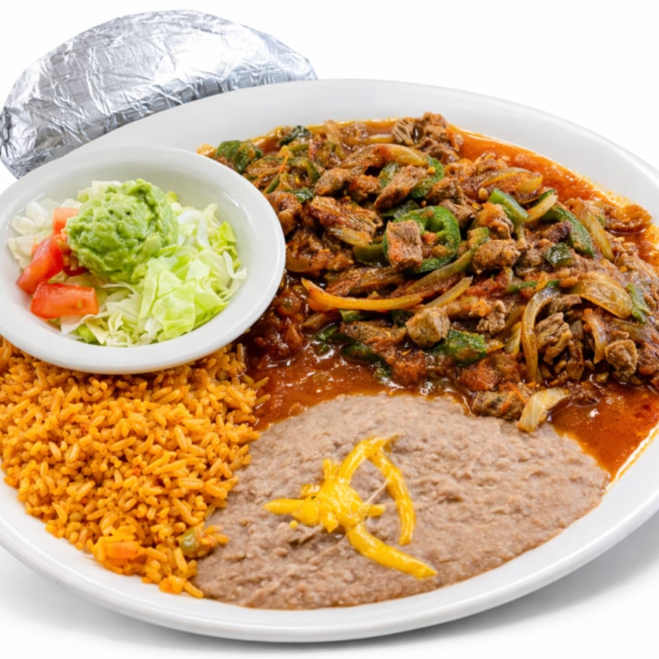 Los Agaves Mexican Restaurant's carne asada with rice, refried beans, guacamole, and salad.