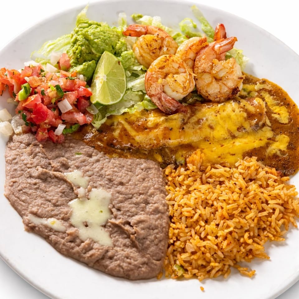 A Mexican dish with shrimp, enchiladas, refried beans, rice, guacamole, pico de gallo, and lime.