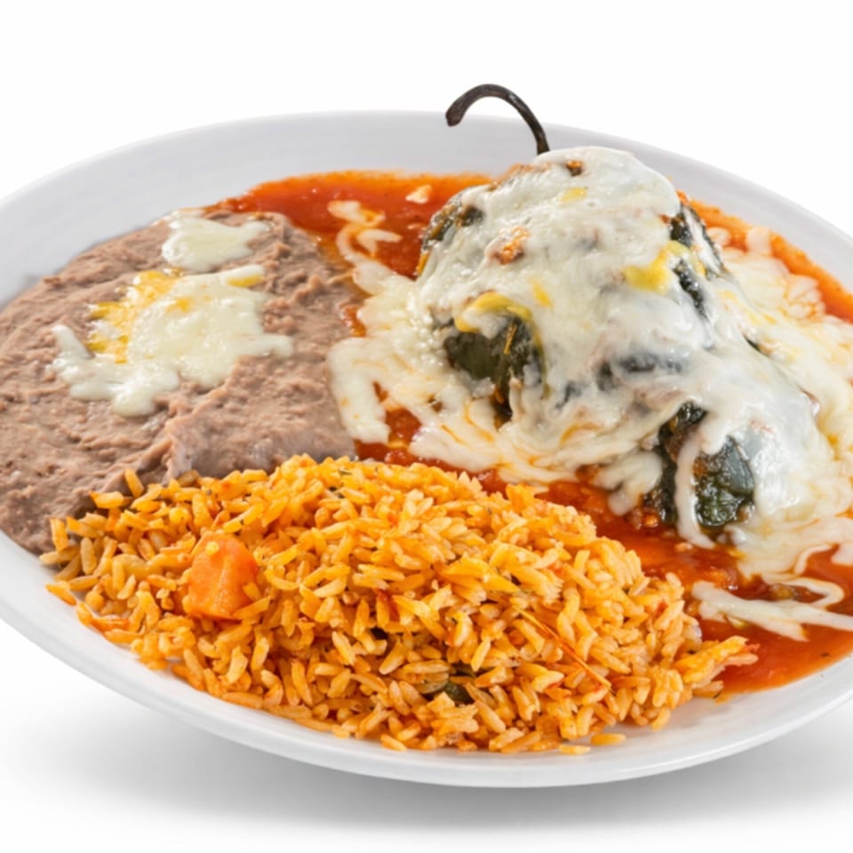 A Los Agaves chile relleno covered in melted cheese and red sauce, served with rice and refried beans.